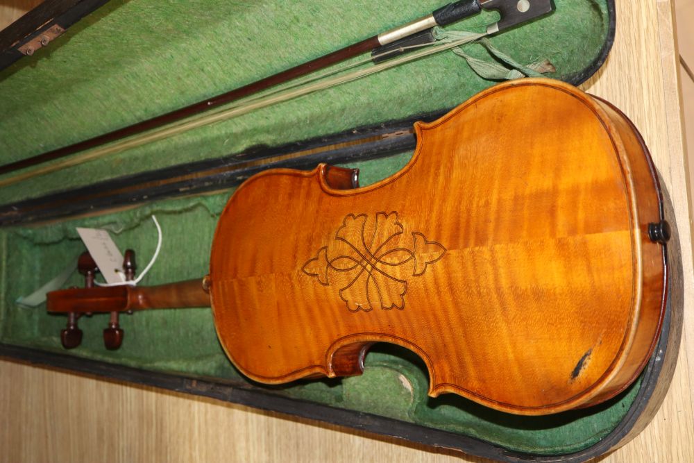 A late 19th century European violin with inlaid decoration, cased with bow, Joseph Guanaris label to interior of violin